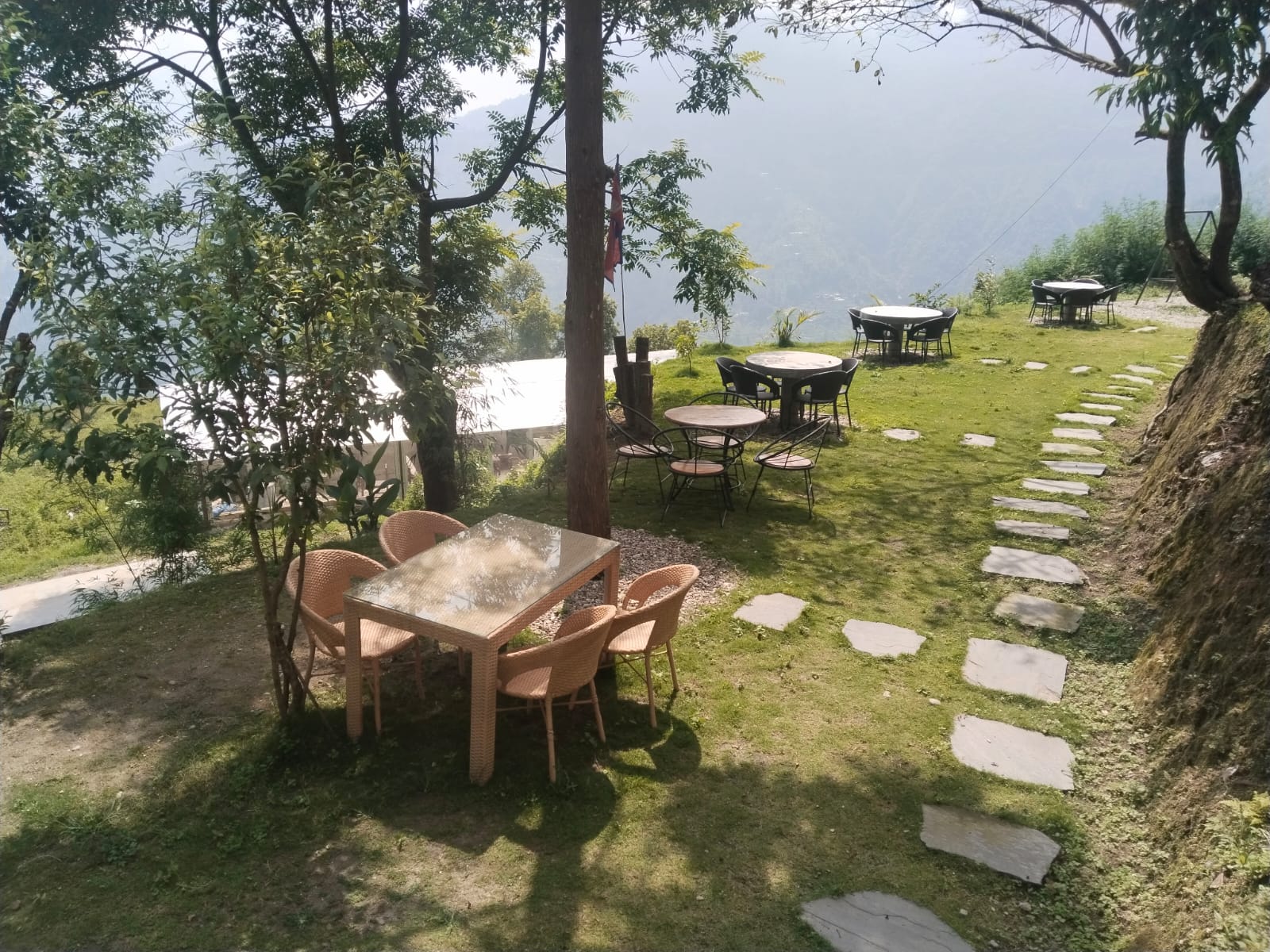 Garden seating among the pine trees at Dhalan Ghar