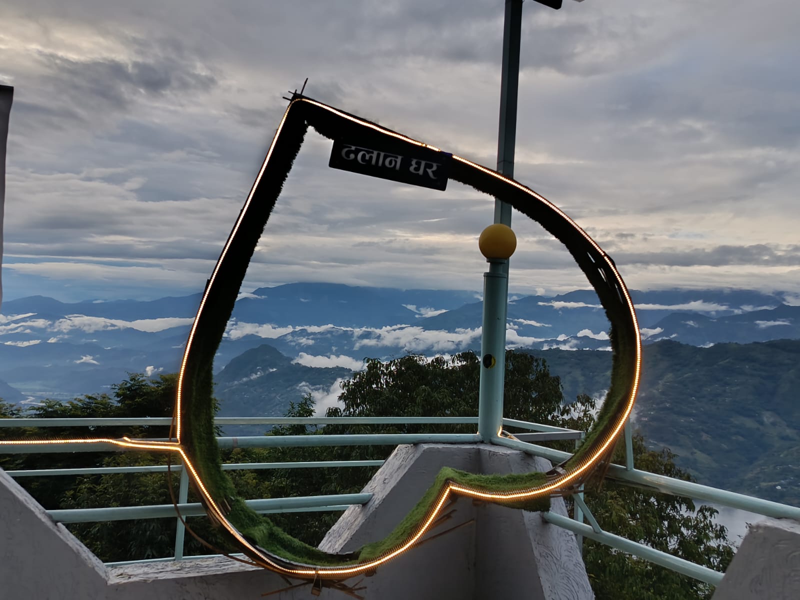 Decorative rooftop viewpoint frame overlooking the cloud sea